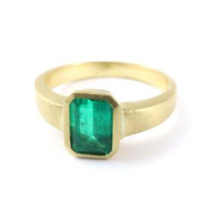 Octagonal emerald solitaire ring in gold