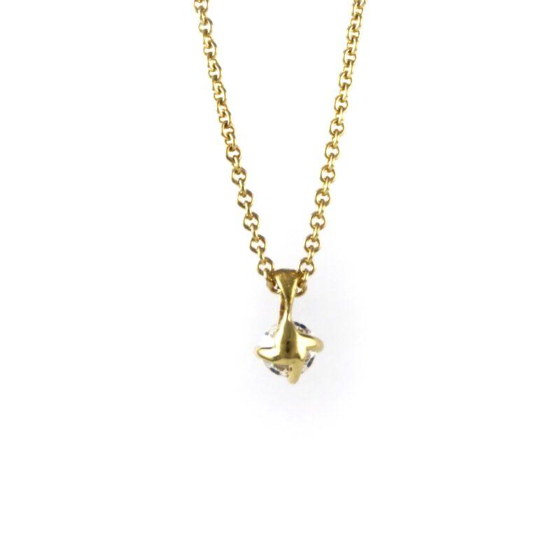 Diamond four claw pendant in gold