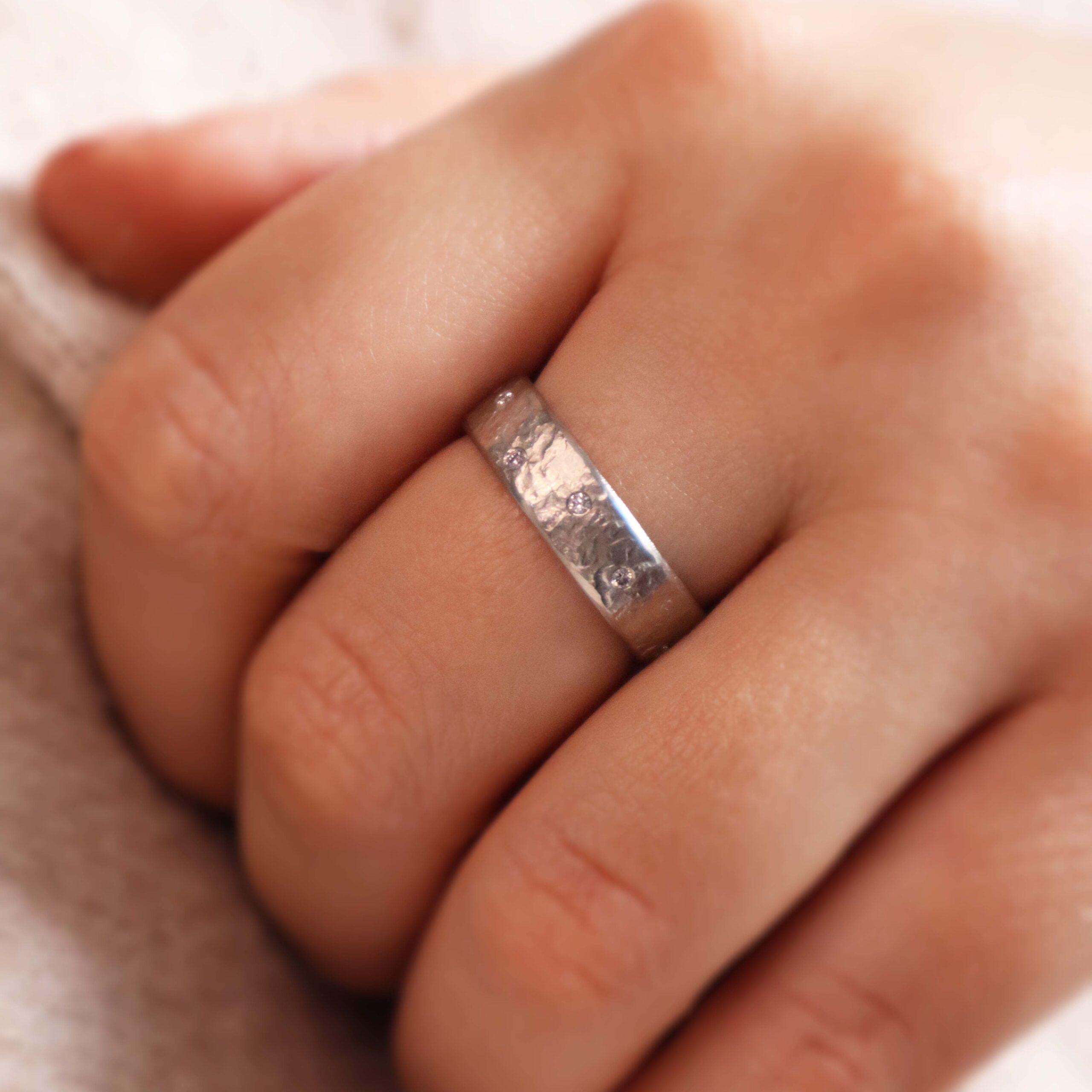 Hammered platinum ring with pale pink diamonds