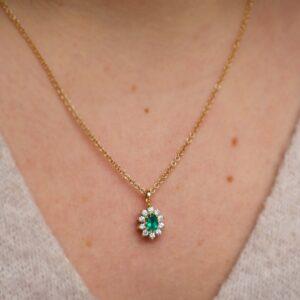 Emerald and diamond cluster pendant in gold