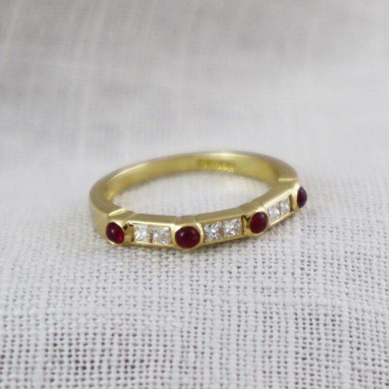 Cabochon ruby and diamond eternity ring